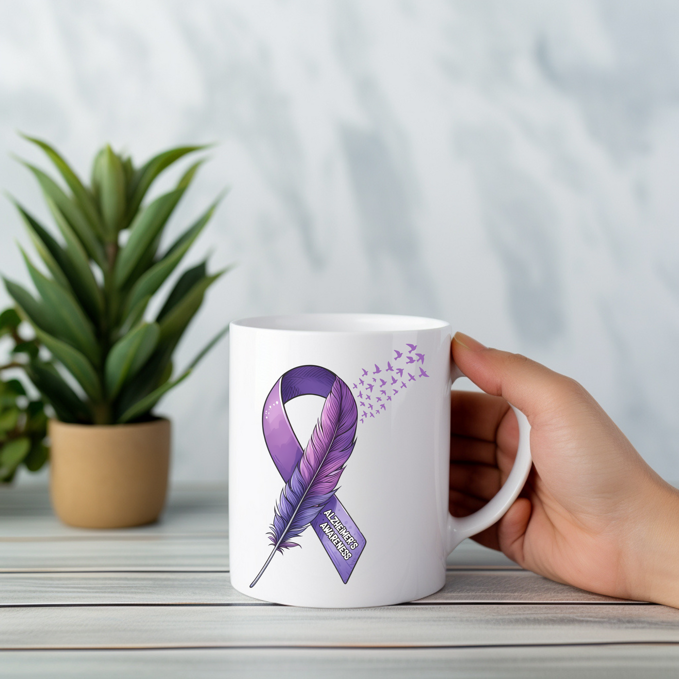 a person holding a coffee mug with a purple ribbon on it