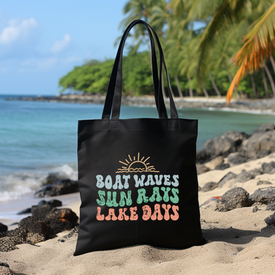 a black bag sitting on top of a sandy beach