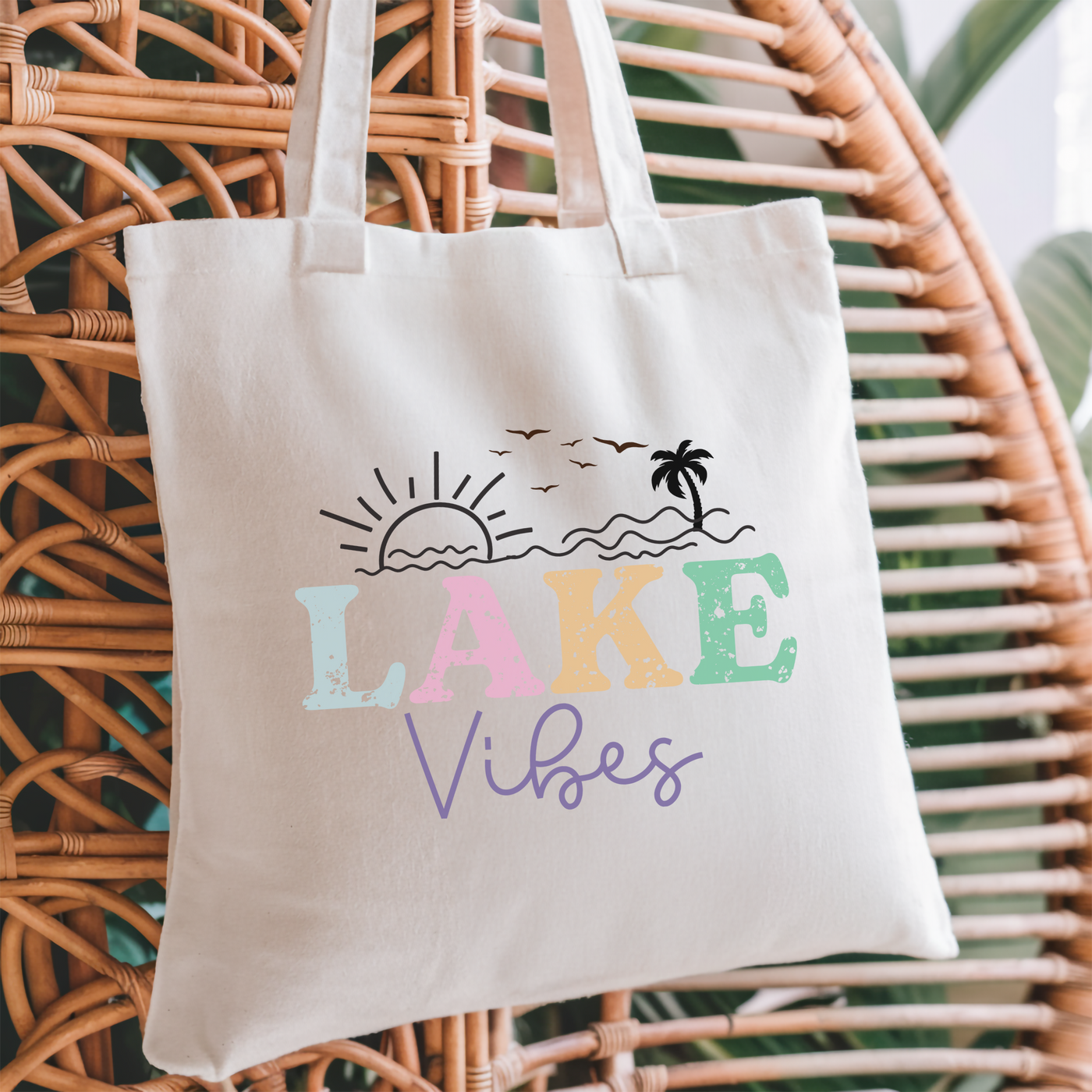 a white tote bag with the words lake vibes printed on it