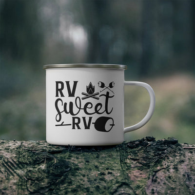 a white coffee mug sitting on top of a tree stump