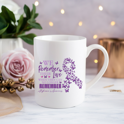 a white coffee mug with a purple ribbon on it