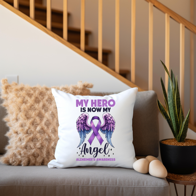 a couch with a pillow that says my hero is now my angel