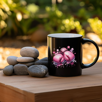 a black coffee mug sitting on top of a wooden table