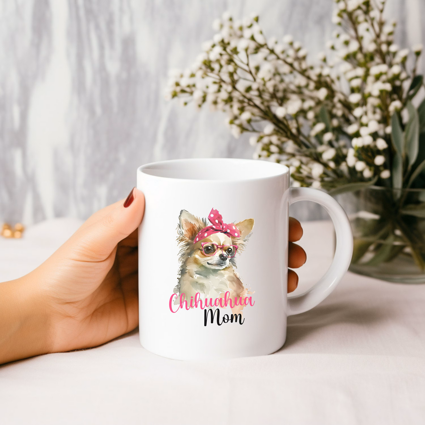 a person holding a coffee mug with a dog on it