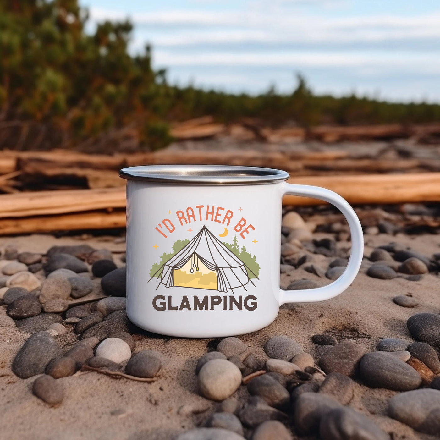 a camp mug sitting on a rocky beach