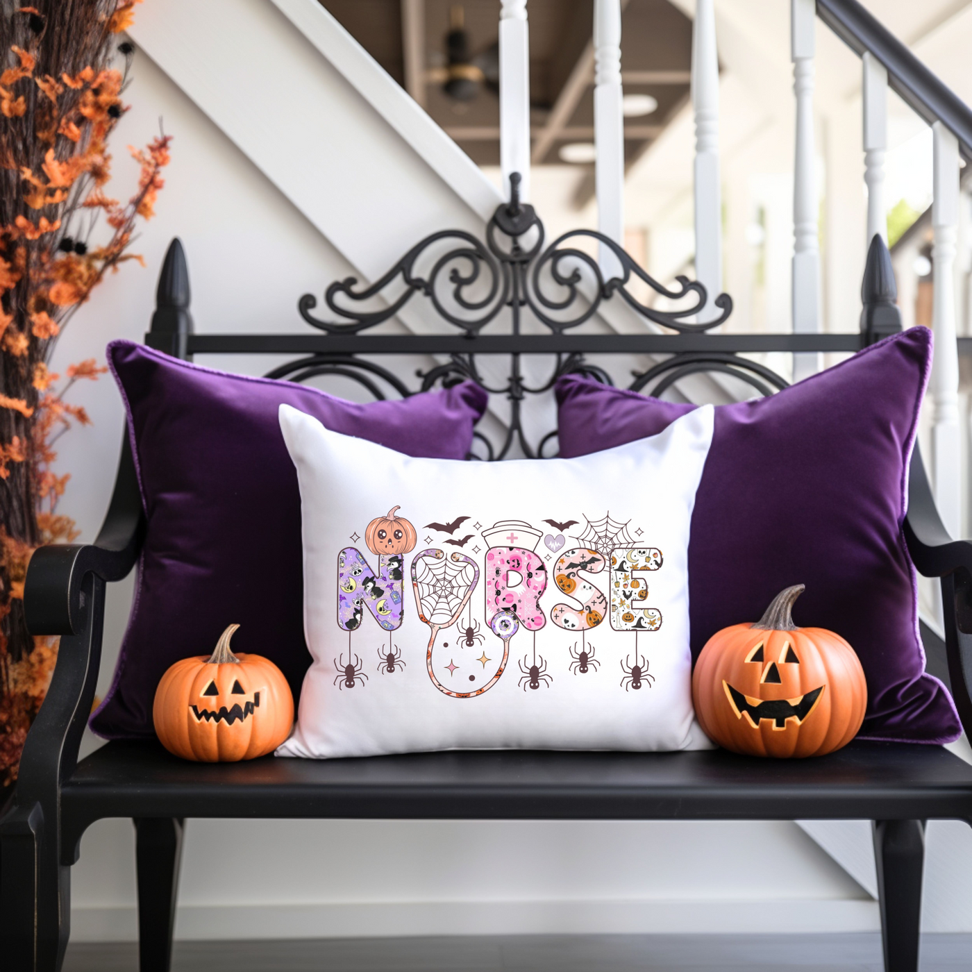 a bench with two pumpkins and a pillow on it