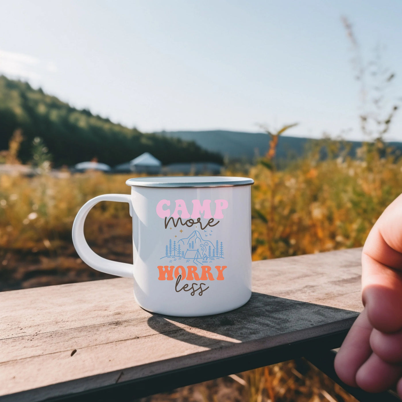 a camp mug sitting on a picnic table