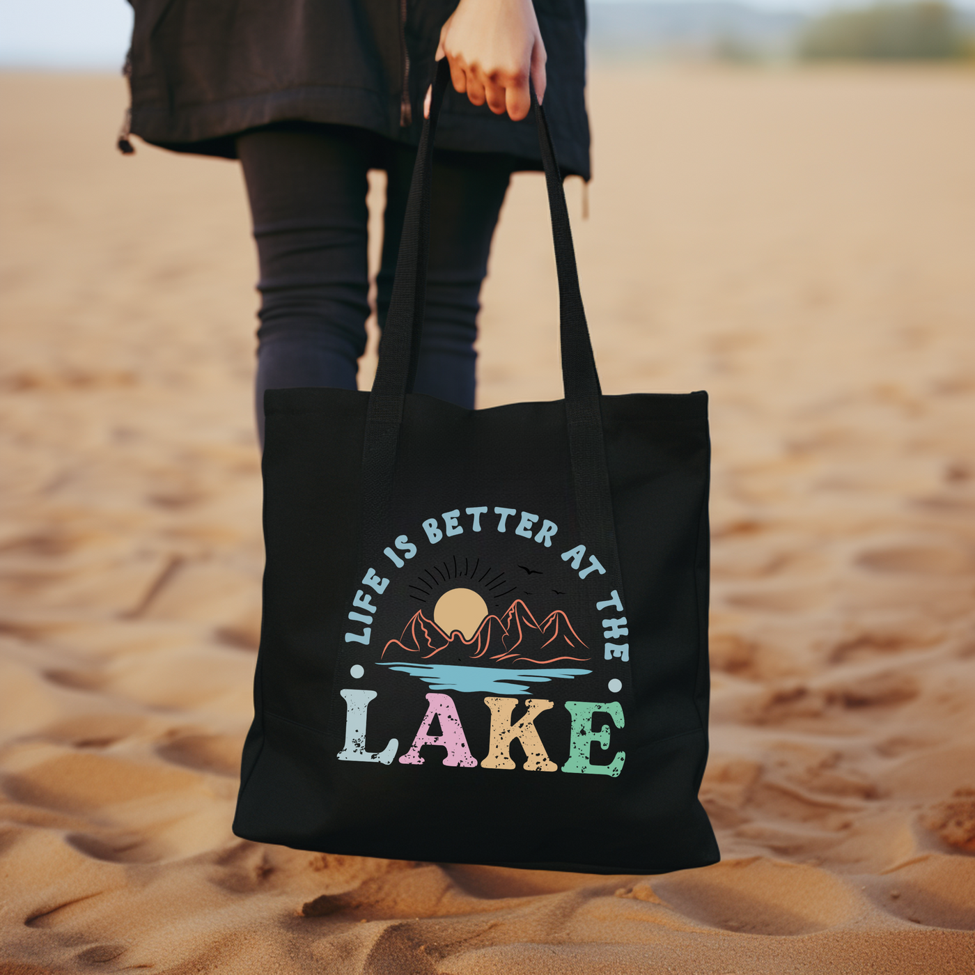 a woman carrying a black bag on a beach