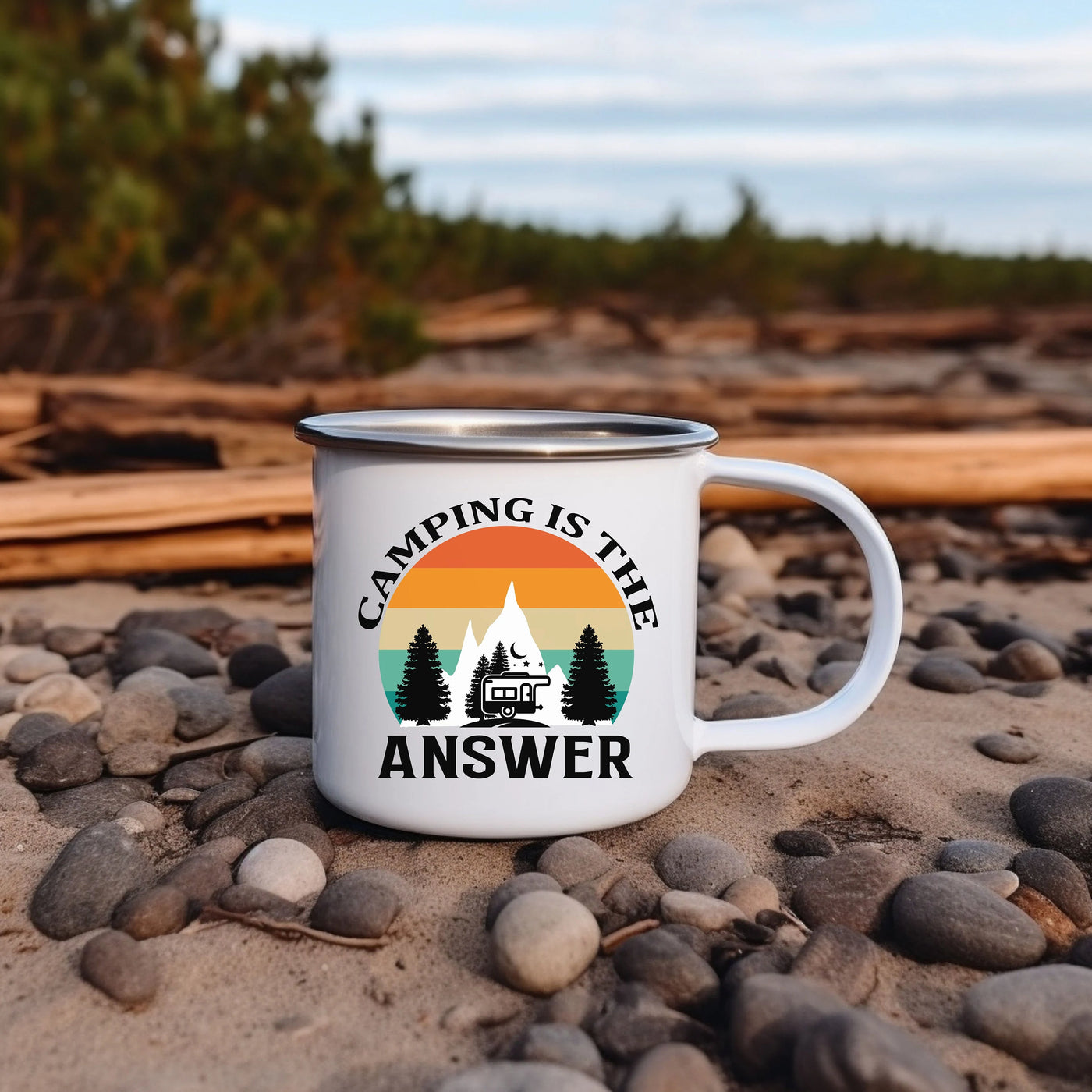 a camping is the answer coffee mug sitting on a rocky beach