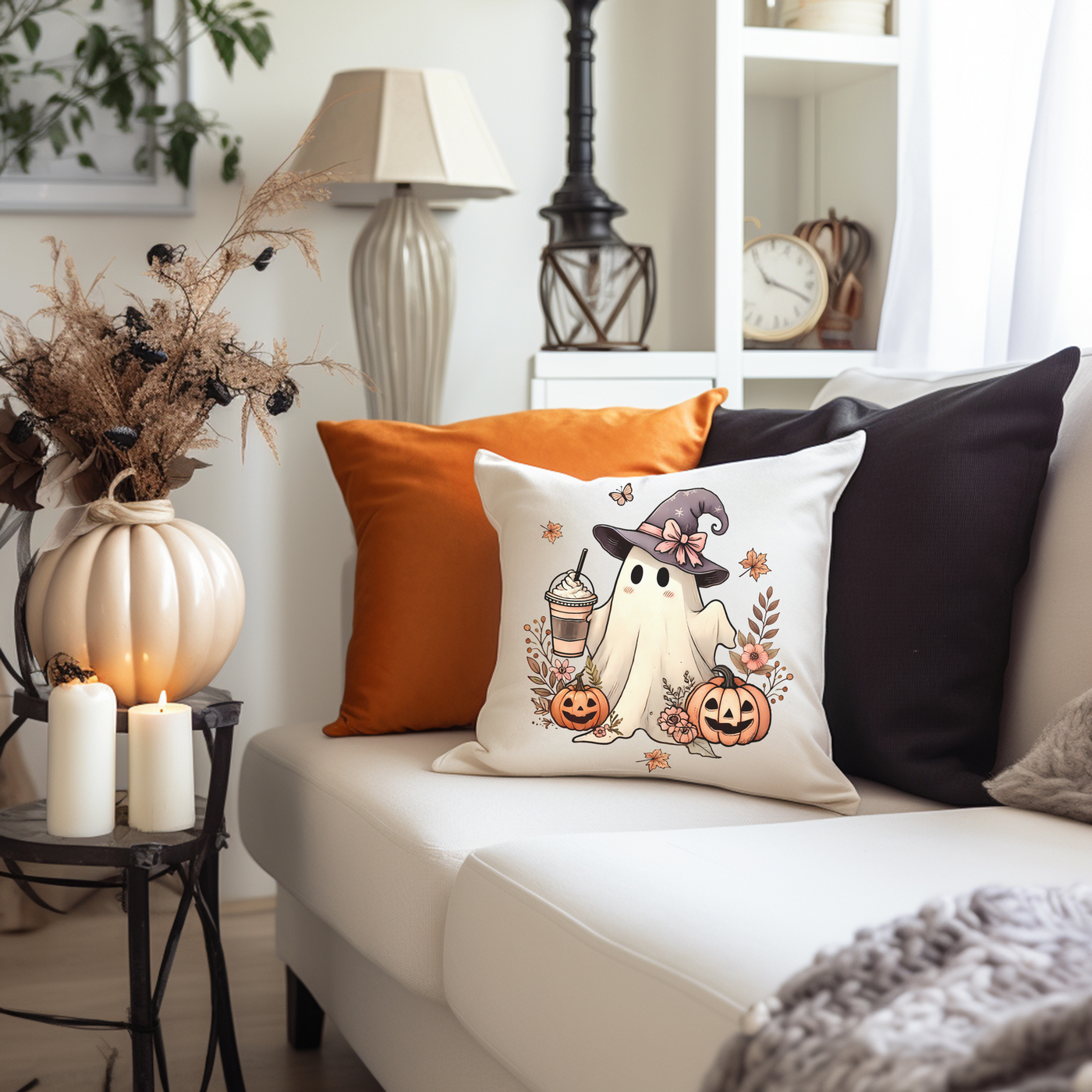 a living room with a white couch and pillows