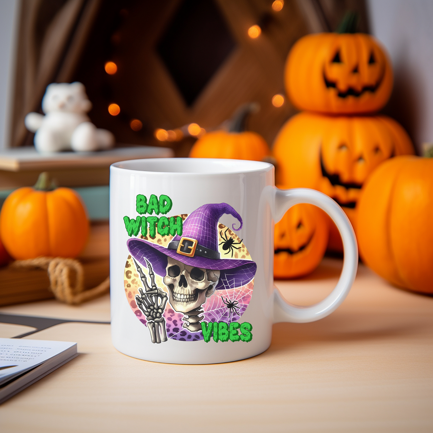 a white coffee mug with a skeleton wearing a witches hat