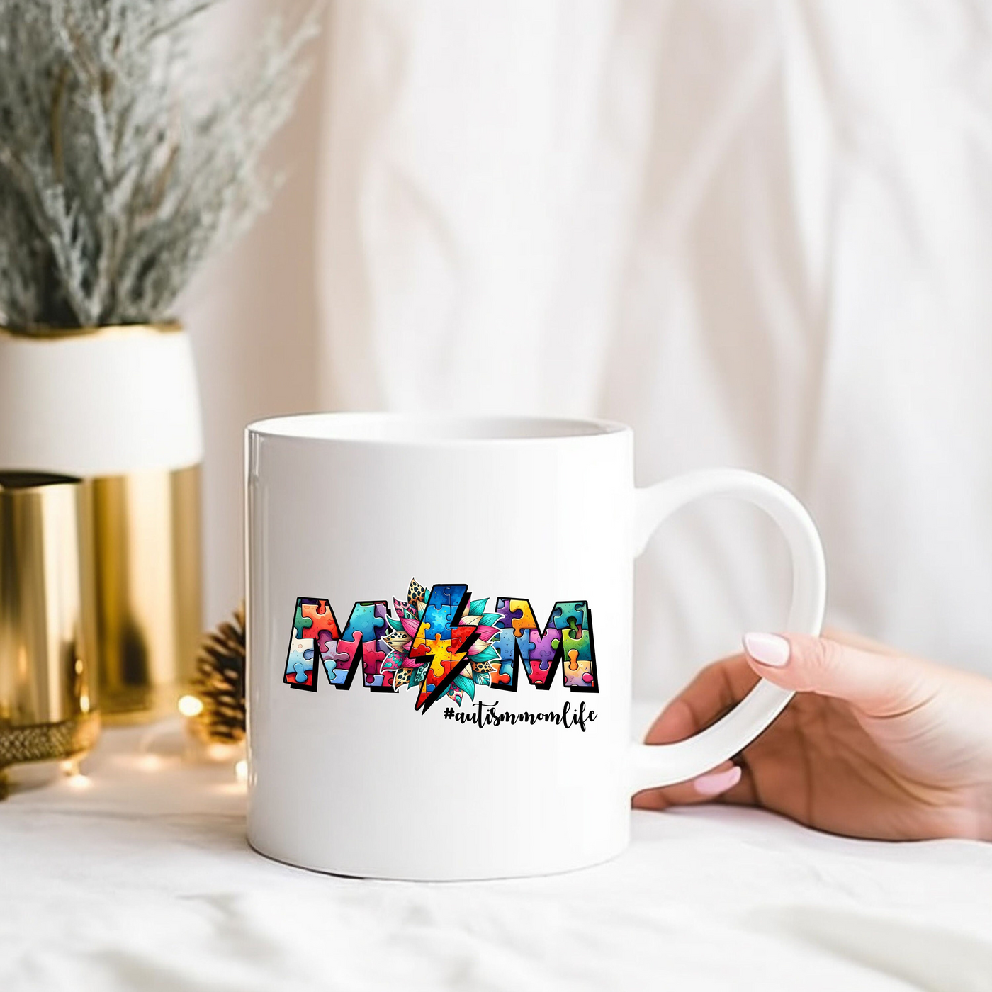 a person holding a white coffee mug with the word minnesota on it