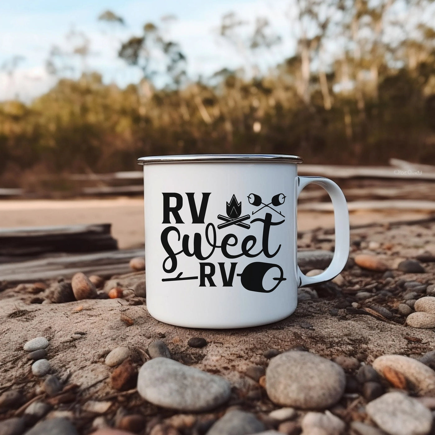 a white coffee mug sitting on top of a pile of rocks