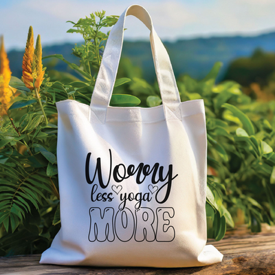 a white tote bag sitting on top of a wooden table