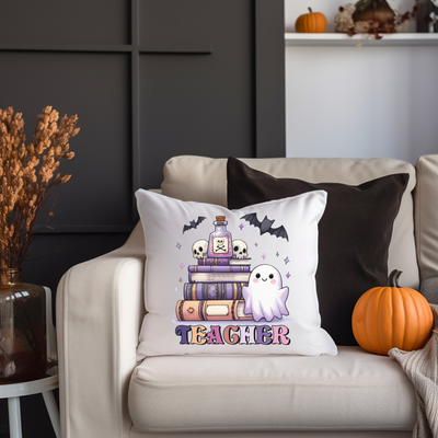 a white couch with a halloween pillow on it