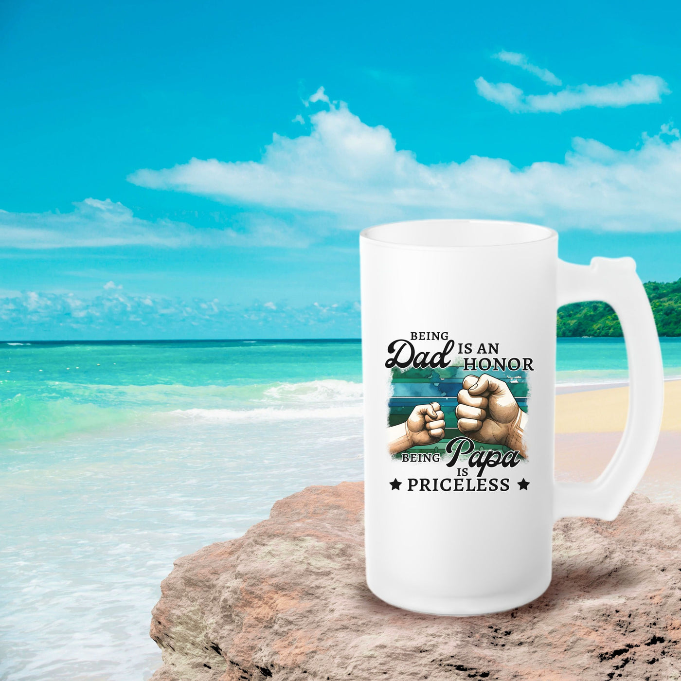 a white coffee mug sitting on top of a beach