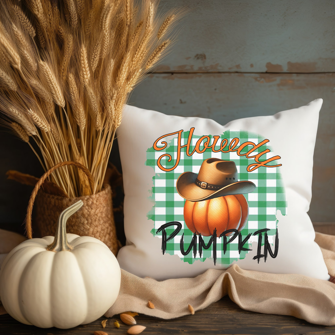 a white pillow with a pumpkin on it