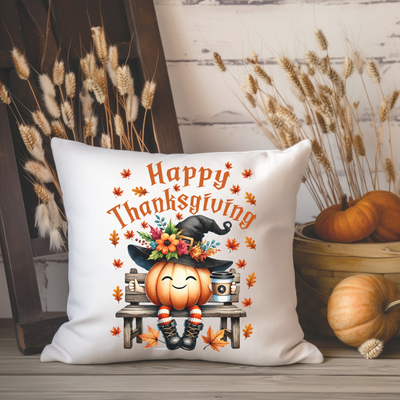 a white pillow with a happy thanksgiving pumpkin on it