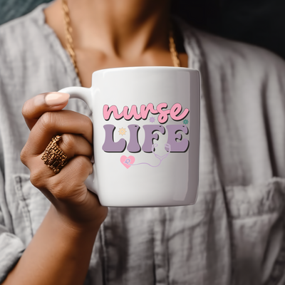 a woman holding a coffee mug with the words nurse life on it