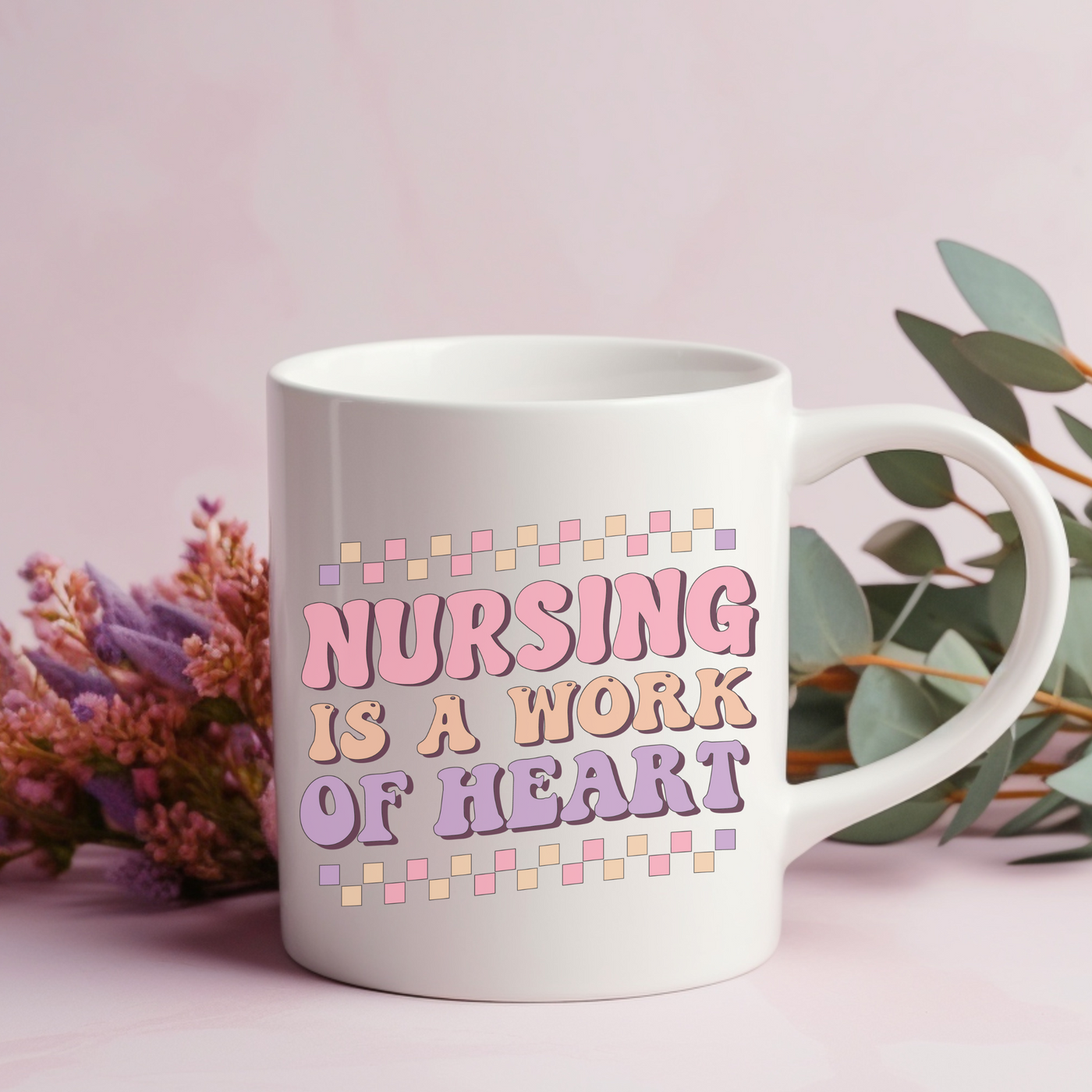 a coffee mug with the words nursing is a work of heart