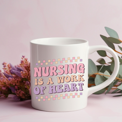 a coffee mug with the words nursing is a work of heart