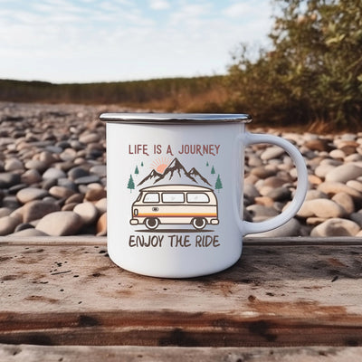 a camper mug sitting on top of a wooden table