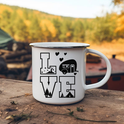 a camper mug sitting on top of a wooden table