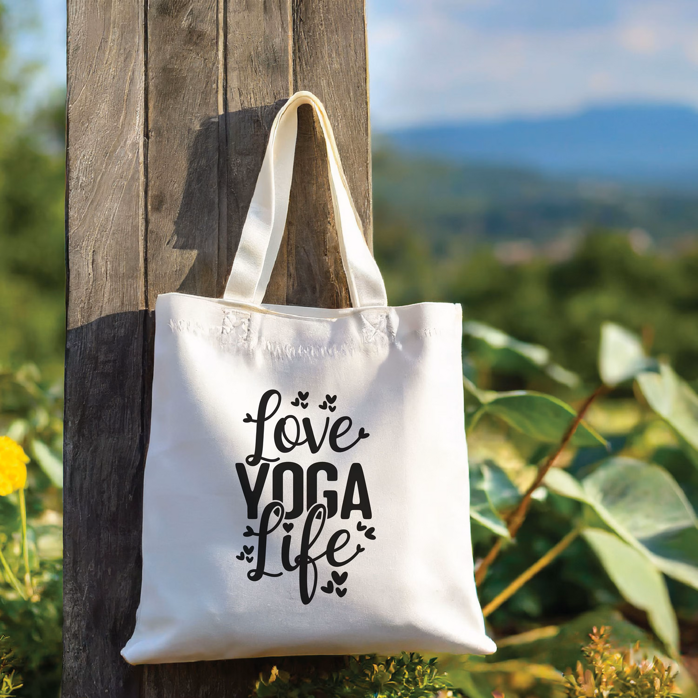 a tote bag hanging from a wooden pole