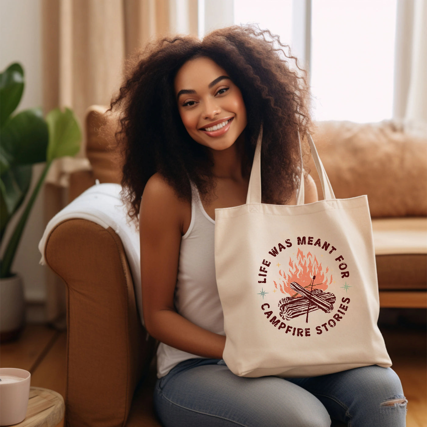 a woman sitting on a couch holding a bag