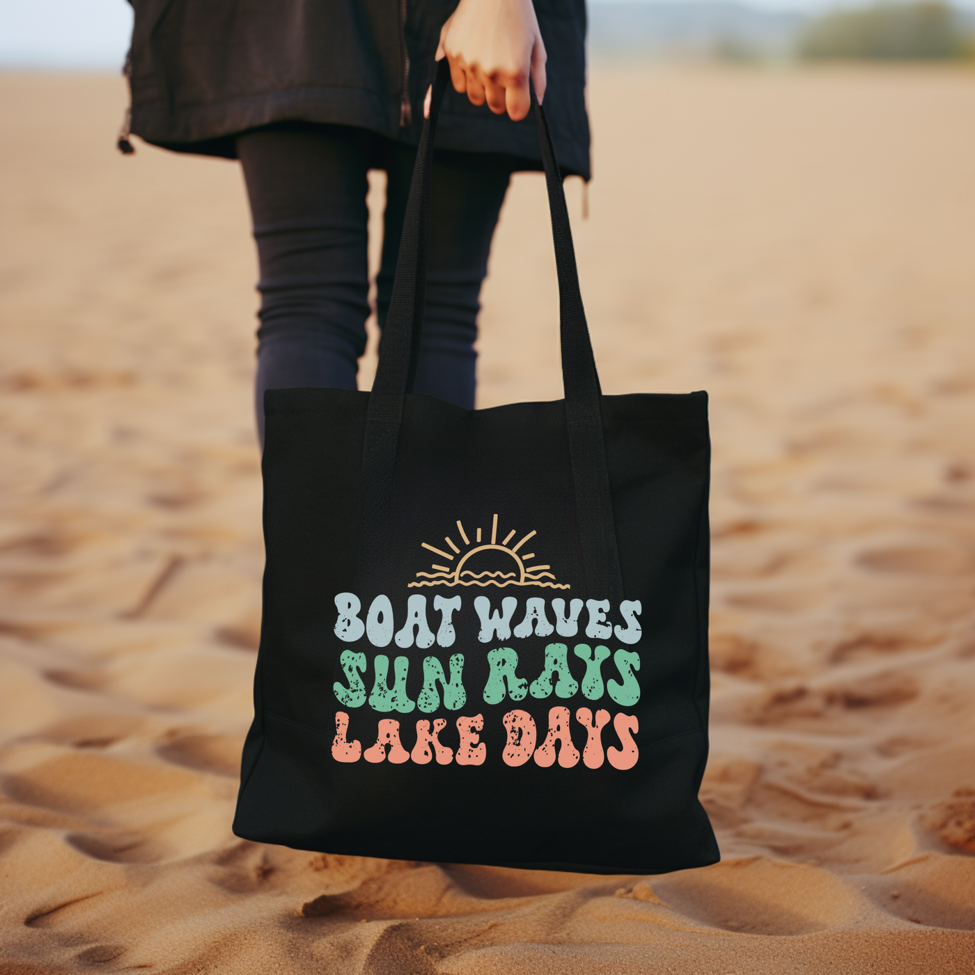 a woman carrying a black bag on a beach