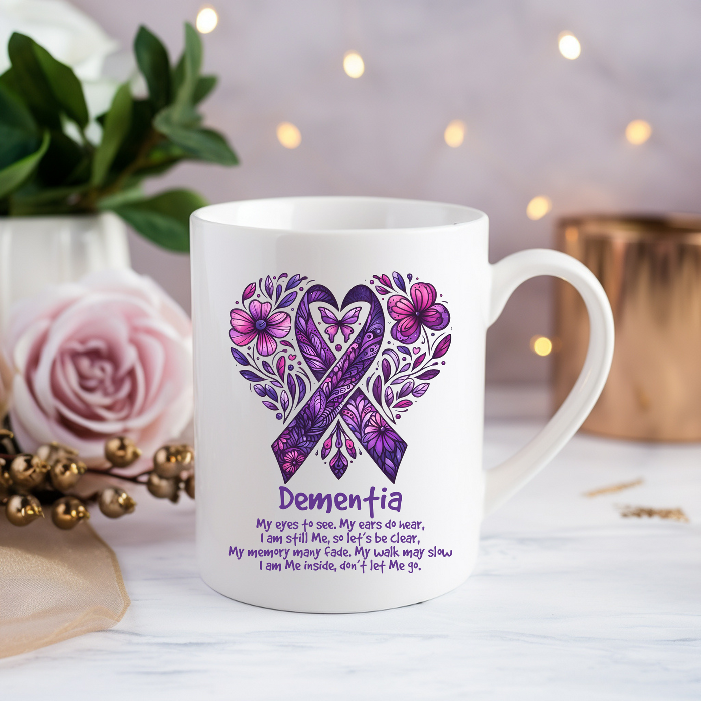 a white coffee mug with a purple ribbon on it