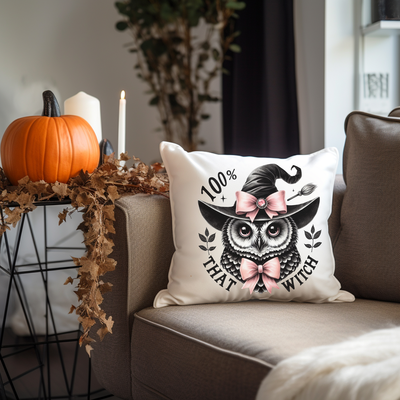 a pillow with an owl on it sitting on a couch