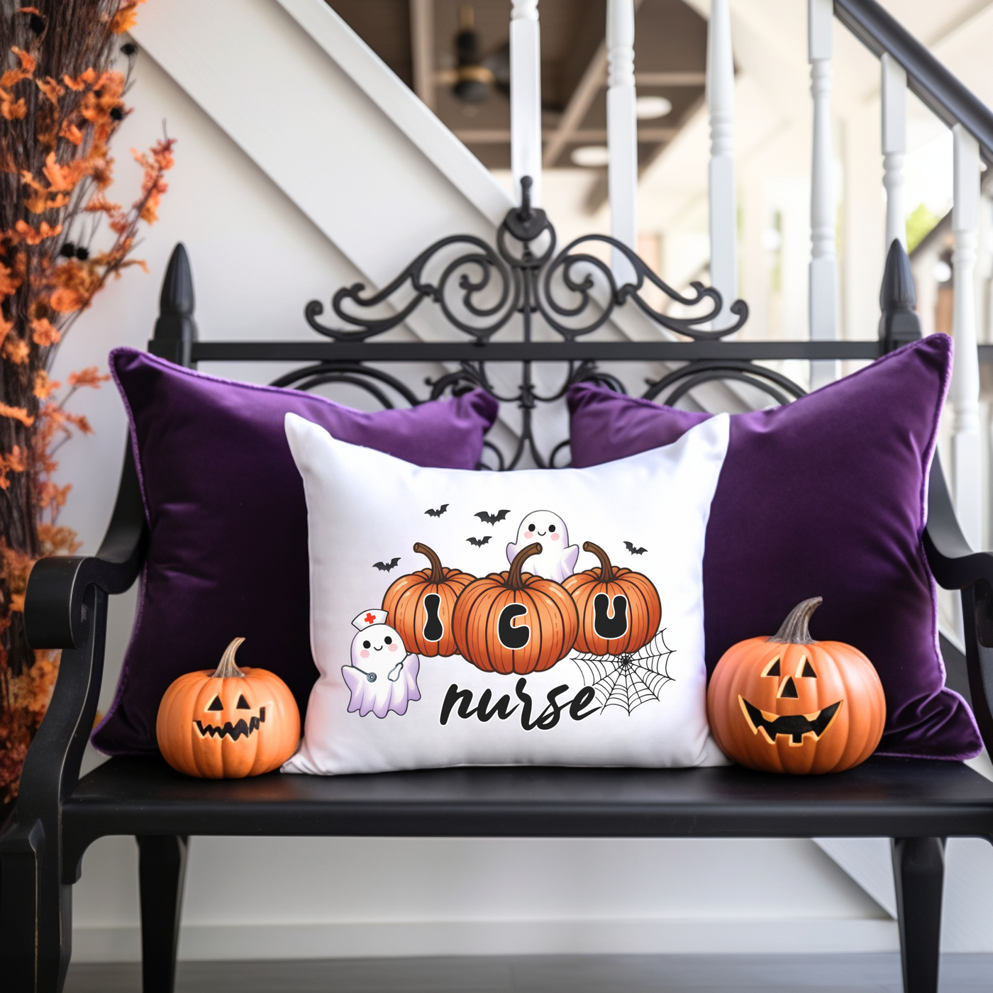 a black bench with three pumpkins on it