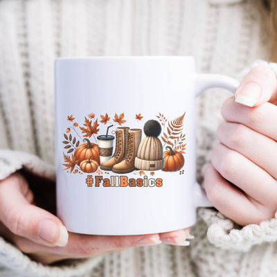 a woman is holding a coffee mug with fall boots on it