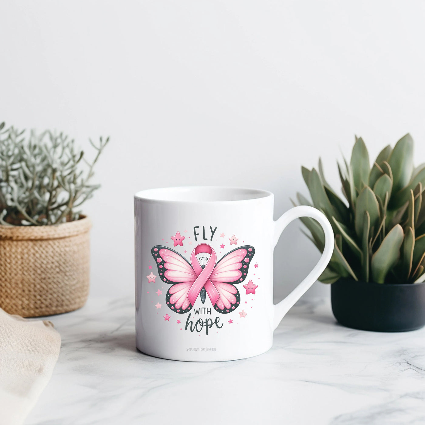 a coffee mug with a pink butterfly on it