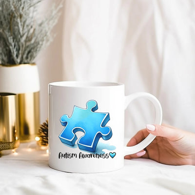 a person holding a coffee mug with a puzzle piece on it