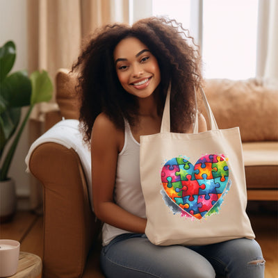 a woman sitting on a couch holding a tote bag