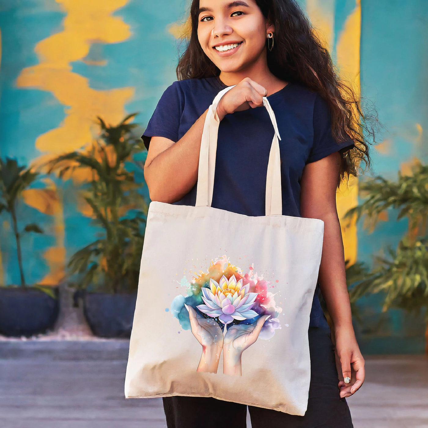 a woman holding a tote bag with a flower on it