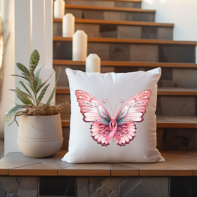 a white pillow with a pink butterfly on it