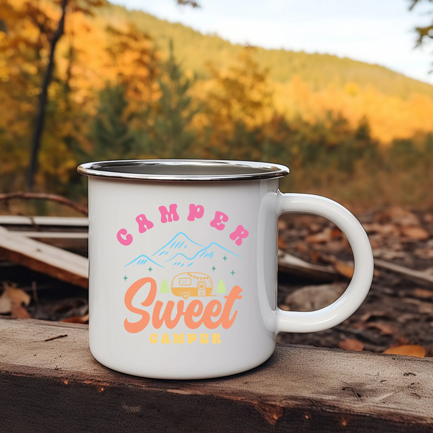 a camper mug sitting on a log in the woods