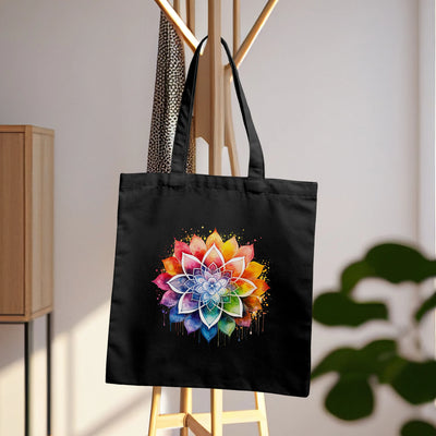 a black tote bag with a colorful flower on it