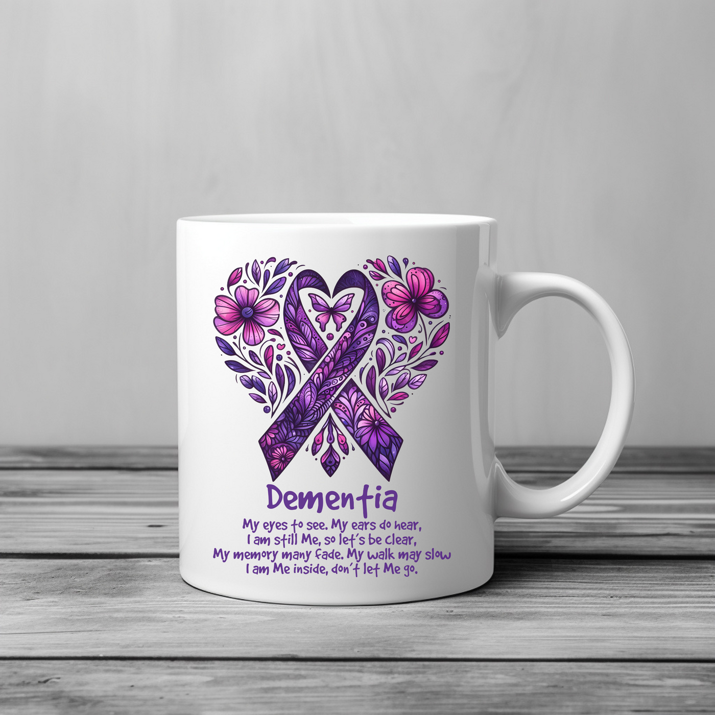 a white coffee mug with a purple ribbon on it