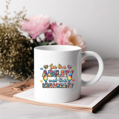 a white coffee mug sitting on top of a table