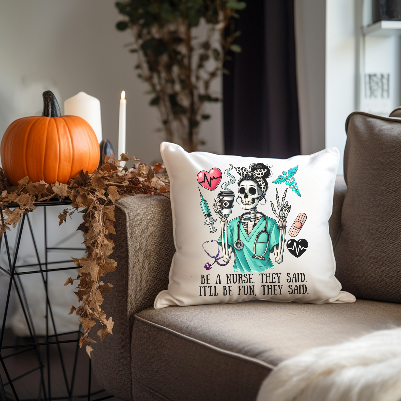 a pillow with a skeleton on it sitting on a couch