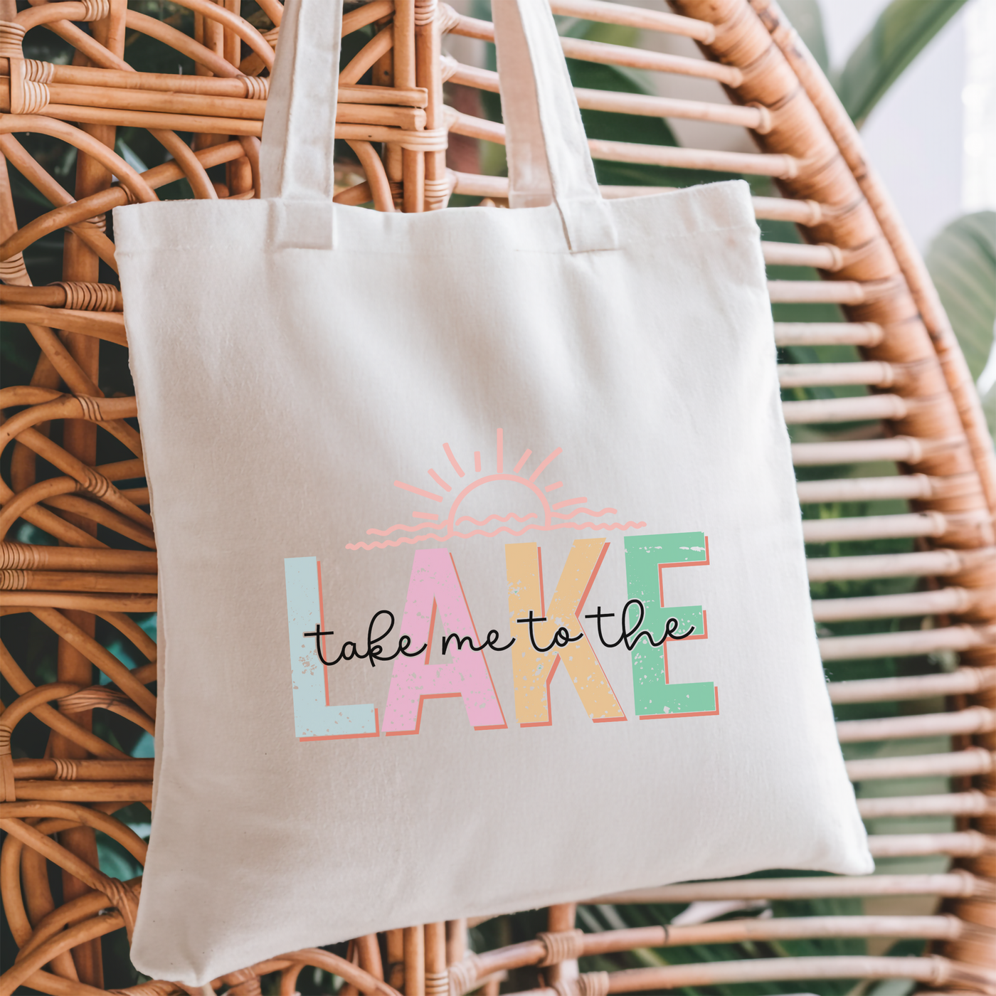 a tote bag that says take me to the lake