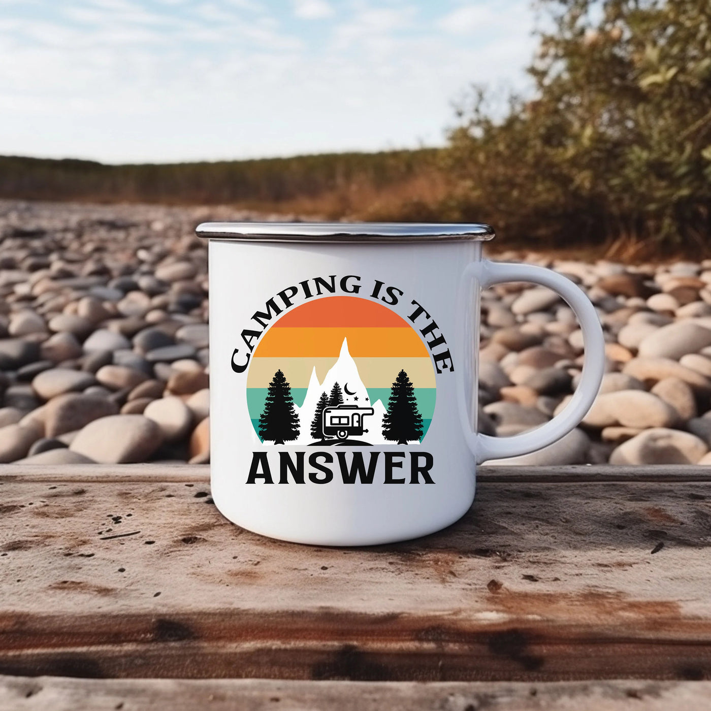 a camping is the answer coffee mug sitting on a wooden table