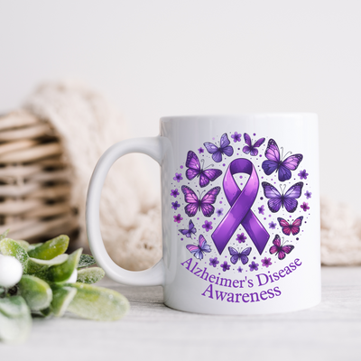 a coffee mug with a purple ribbon on it