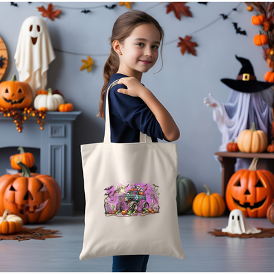 a little girl holding a trick or treat bag