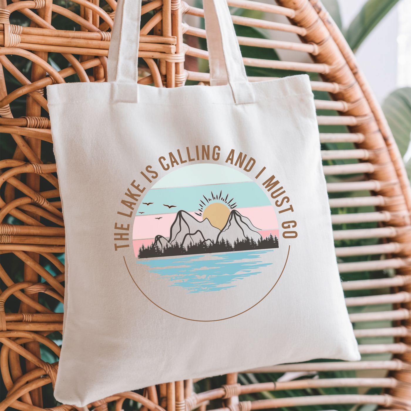 a tote bag sitting on top of a wicker chair