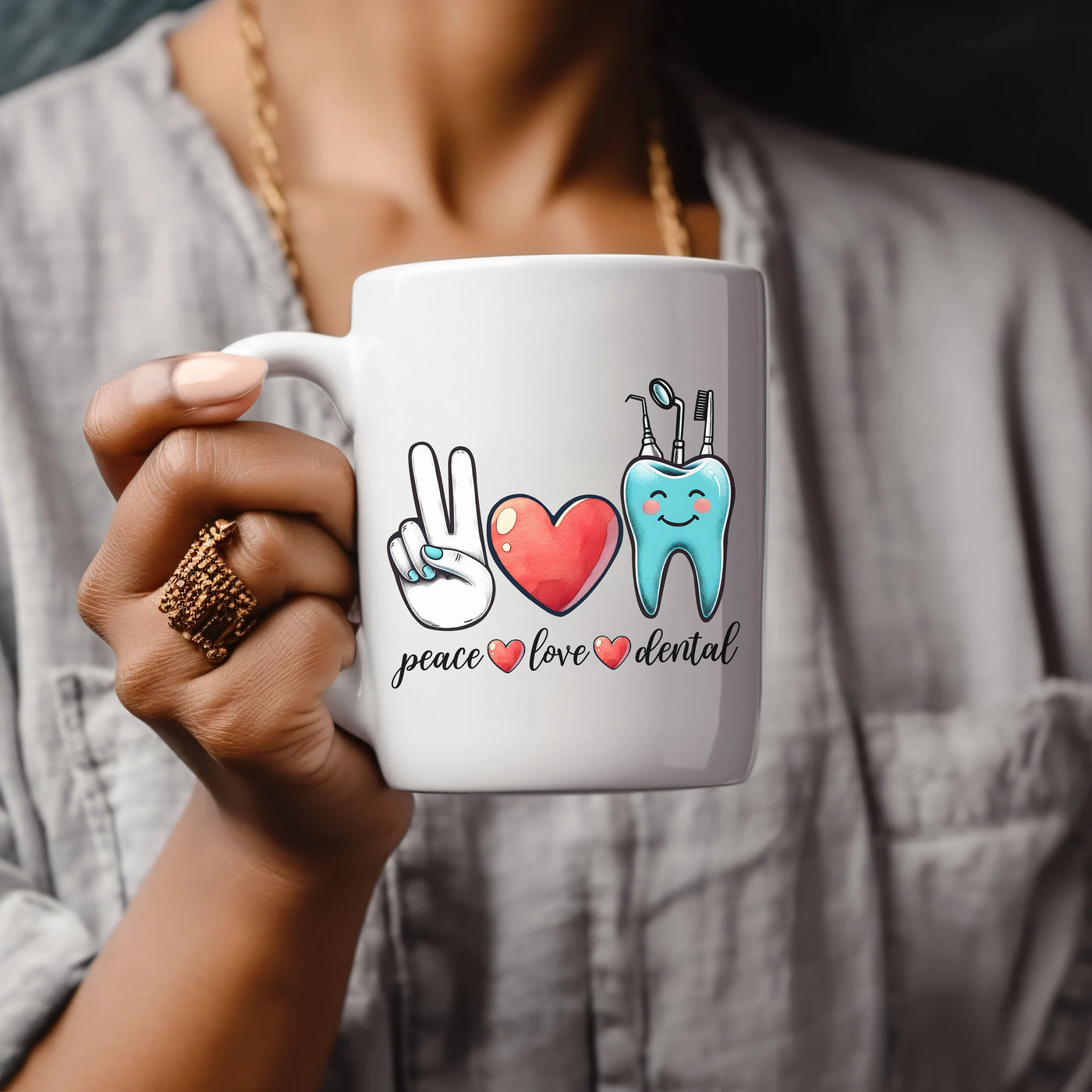 a woman holding a coffee mug with a peace love mental design on it